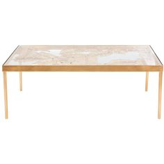 a marble top coffee table with gold legs