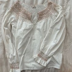 New With Tags Faherty Laura Embroidered Top In White Whisper. Size Medium. Has One Small Black Smudge (Pictured) Otherwise In Great Condition. White Peasant Top With Lace Trim, Beige Cotton Tops With Embroidered Hem, White Long Sleeve Peasant Top With Embroidered Hem, Casual White Peasant Top With Embroidered Hem, White Bohemian Embroidered Cotton Top, White Long Sleeve Cotton Peasant Top, White Cotton Long Sleeve Peasant Top, White Cotton Embroidered Top With Lace Trim, White Peasant Top With Embroidered Hem