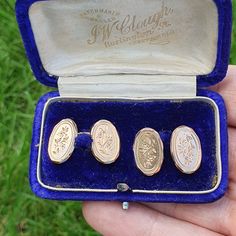 A lovely pair of antique 9ct gold cufflinks in nice condition with presentation box. The cufflinks are oval in shape with foliage engravings to all face sides and are connected with curb link chain . The total weight is approx. 6.9 g and they are hallmarked with date letter "o" for 1933. There are minor surface scratches commensurate with age and the presentation box is in antique condition. Please see listing photos for measurement. Please check out the other items in my shop. Be sure to view a Luxury Vintage Cufflinks For Anniversary, Antique Hallmarked Cufflinks For Wedding, Hallmarked Antique Cufflinks For Wedding, Antique Engraved Cufflinks For Wedding, Antique Gold Cufflinks For Collectors, Antique Gold Cufflinks, Formal Jewellery, Formal Jewelry, Gold Cufflinks