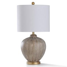 a table lamp with a white shade on it