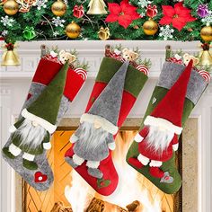 three christmas stockings hanging from a mantel