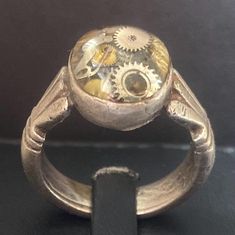 Make a bold statement with our Daring Steampunk Men's Ring, crafted from textured metal and featuring striking gear accents. This eye-catching piece blends rugged charm with intricate detailing, perfect for the modern man who embraces individuality. Ideal for both everyday wear and special occasions, it's a must-have for any steampunk enthusiast! Steampunk Man, Men's Ring, Modern Man, Rings Statement, Statement Rings, The Modern, Porter, Beauty Book, Everyday Wear