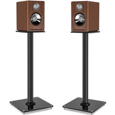 two wooden speakers sitting on top of each other in front of a white background,