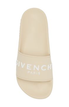 A bold Givenchy logo stamp crosses the wide strap of cushy, water-friendly sliders. Synthetic upper, lining and sole Made in Italy Women's Designer Shoes Luxury Summer Slides With Rubber Sole, Designer Slides With Branded Insole For Beach, Designer Beach Slides With Branded Insole, Designer Slides For Summer, Luxury Beach Slides With Rubber Sole, Designer Beach Slides With Cushioned Footbed, Luxury Summer Sandals With Logo, Logo Print Slip-on Sandals For Summer, Designer Summer Slides With Removable Insole