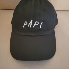 Papi Hat Adjustable Strap Color---Blk/White Like New Condition Never Worn Pre-Owned Black Brimmed Baseball Cap With Letter Print, Black Letter Print Baseball Cap, Black Brimmed Dad Hat, One Size, Adjustable Brimmed Black Dad Hat, Black Adjustable Brimmed Dad Hat, Adjustable Black Brimmed Dad Hat, Black Brimmed Dad Hat, Casual Black Brimmed Dad Hat, Casual Black Dad Hat For Beach