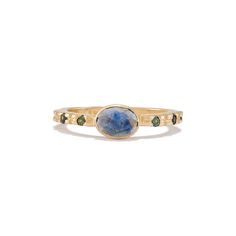 The perfect diamond alternative, this stunning ring features a blue Montana sapphire bezel set with fair trade teal Australian sapphires set along each side on a Fairmined® 14k yellow gold band. Sizes & Options One 6x4mm rose cut blue Montana sapphire and 6 flanking 1.75mm teal Australian sapphires set in Fairmined® 14k yellow gold. 6mm at widest with a 2mm hammered band. Available in 14k yellow gold. Rose and white gold available by special order. Although some pieces are kept in stock, most EP Modern Diamond Rings, Classic Diamond Ring, Oval Sapphire Ring, Montana Sapphire Ring, Alternative Metal, Hammered Band, Diamond Alternatives, Fine Ring, Montana Sapphire