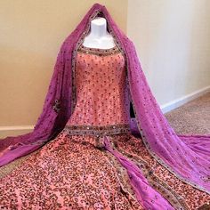 Absolutely Gorgeous, Light Pink, Heavy Ornate Work, Never Worn, 3 Piece Lengha Wedding Dress. Embellishments Include Bead Work, Crystals, Pearls, Sequins, And Gold Thread. Comes With Bridal Bag. Brand New, Never Worn, With No Tears Or Stains. Please Note, This Item Is Very Heavy Due To It's Ornate Design And For Bridal Wear. Lengha Measurements: Top: Shoulder: 15 Chest: 40 Hip: 38 Length: 25 Sleeve Length: 15 Skirt: Waist: 16 Inches Length: 44 Inches Purple Wedding Gown With Intricate Embroidery, Pink Gown With Dabka Work For Wedding, Pink Wedding Gown With Dabka Work, Fitted Hand Embellished Wedding Salwar Kameez, Purple Anarkali Gown For Wedding, Purple Anarkali Wedding Gown, Pink Lehenga With Dabka Work For Wedding, Wedding Fitted Hand Embellished Salwar Kameez, Festive Purple Wedding Dress