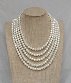 PREFERENTIAL POLICIES : The order is $50 or more.There will be a 10% discount.long-term effective. Please use the coupon code: CZH10 Welcome back to my shop: https://www.etsy.com/shop/pearlandjewelry Description of the product in the picture: The necklace is 18---24 inches long ,I make the necklace to use 8mm ivory glass pearls,5 strands glass pearl necklace ,It is nice for your wedding. The picture color is ivory. Can choose other colors are:ivory,white,light pink,Black, red, teal, gray, dark g White Pearl Bridal Necklace For Bridal Shower, White Pearl Necklace For Bridal Shower, Elegant White Necklaces For Bridal Shower, Magnolia Pearls, Ivory Pearl Necklace, Grey Pearl Earrings, Wedding Bridesmaid Jewelry, Pearl Necklace Wedding, Gold Jewelry Earrings