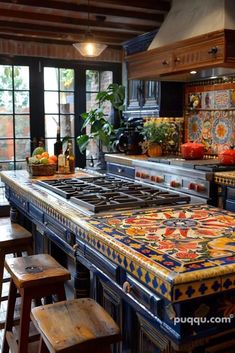 a kitchen with an island counter and stools next to the stove top, surrounded by potted plants