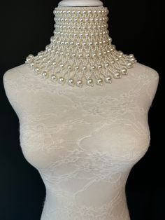 Handmade Chocker Style pearl shoulder body Jewellery.  High quality pearls. Statement piece. Perfect for special events, fashion shows, bridal, special evenings, weddings.  Stunning Ivory pearls with bead detail.  UK Size 6-12 White Pearl Chain Backdrop Necklace For Party, Party Pearl Backdrop Necklace, Party Backdrop Necklace With White Pearl Chain, Party White Backdrop Necklace With Pearl Chain, White Beaded Backdrop Necklace For Evening, Pearl Backdrop Necklace For Parties, Evening White Beaded Backdrop Necklace, Beaded Pearl Bridal Necklace For Party, Pearl Embellished Beaded Necklaces For Party