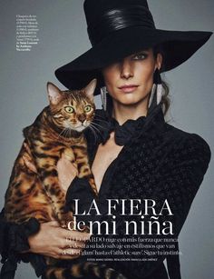 a woman holding a cat in her arms on the cover of magazine la fiera