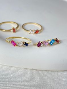 "Our Birthstone Baguette Ring is an be personalized with the birthstones of all of your loved ones. Each gemstone ring is handcrafted and personalized with a birthstone of your choice.  💖Family birthstone jewelry & personalized ring will become your and your loved ones favorite.  🎁Make ready your favorite dainty rings for women's as couples gift, mothers day gift, birthday gifts, mom gifts, bridesmaid gifts, Christmas gifts, anniversary gifts, couple gifts and more!  ✋All our custom rings %100 custom made by hand with Love and Care in our workshop! Nickel Free High Quality Materials Standard Deliver in 8-12 Business Days *How to customize your crystal ring Order? Please see font sample at last image. Leave a not at \"Note to seller\" with name that you would like to have on necklace.   1 3 Birthstone Ring, Elegant Gold Multi-stone Birthstone Ring, Personalized Gold Birthstone Ring As Gift, Yellow Gold Multi-stone Birthstone Ring As Gift, Multi-stone Birthstone Ring Gift, 14k Gold Three-stone Birthstone Ring As Gift, Family Rings, Baguette Ring, Personalized Gifts For Mom