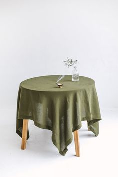 a round table with a green cloth on it