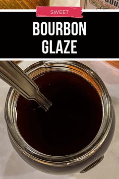 a jar of bourbon glaze sitting on top of a table