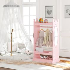 a white and pink bedroom with a canopy bed, teddy bear toys and other items