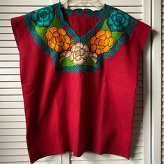 Embroidered Mexican Red Blouse, Size M Please See Photos For Measurements New Without Tags Red Bohemian Embroidered V-neck Top, Casual Red Blouse With Floral Embroidery, Red Sleeveless Tops With Floral Embroidery, Sleeveless Red Tops With Floral Embroidery, Red Sleeveless Top With Floral Embroidery, Red V-neck Blouse With Floral Embroidery, Red Folk Tops With Floral Embroidery, Red Embroidered Folk Blouse, Casual Red Cotton Embroidered Top