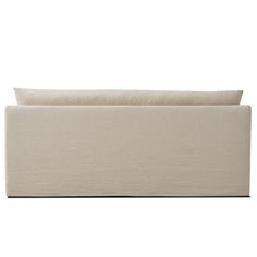 an upholstered couch with white linen on it's back and the arms folded out