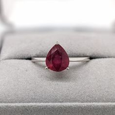 This solitaire ring features a 3.59-carat pear-shaped ruby gemstone with a tapered shank, all set in solid 14K gold. This ring can be a beautiful July birthstone gift for your loved ones! This ring is made with solid 14K Gold. As listed, this ring is ready to ship. If you're interested in purchasing this setting with a different center stone please message us! Designer Silver Jewellery, Jewelry Showcases, July Birthstone, Ruby Gemstone, Ruby Ring, Earring Findings, Pendant Bracelet, Solitaire Ring, Estate Jewelry