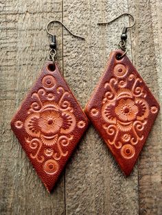 Bohemian Hand-tooled Leather Earrings, Hand Tooled Adjustable Dangle Earrings, Brown Bohemian Concho Earrings, Festival Handmade Leather Earrings, Handmade Leather Earrings For Festivals, Handmade Southwestern Leather Earrings, Brown Hand Tooled Dangle Earrings, Hand Tooled Brown Dangle Earrings, Artisan Brown Hand Tooled Earrings