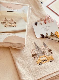 the table is covered with personalized items for guests to use on their wedding day