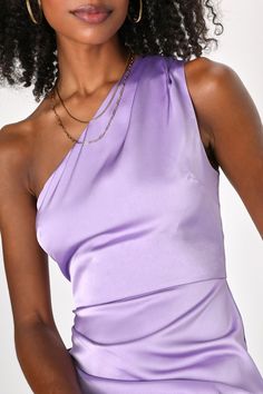 Walk in wearing the Lulus Love Me Tonight Lavender Satin One-Shoulder Mini Dress and the romance is sure to follow! Smooth satin shapes this gorgeous dress that has a one-shoulder neckline and a wide, single tank strap that support a darted bodice. The high waist falls to a figure-hugging mini skirt that has flattering, light pleating on the side. Hidden back zipper/clasp. Fit: This garment fits true to size. Length: Mid-thigh. Size medium measures 34" from shoulder to hem. Bust: Works best for A to C cup sizes - consider sizing up for fuller bust. Waist: Fitted - very fitted at natural waist. Hip: Fitted - consider sizing up for fuller hips. Undergarments: May be worn with a strapless bra, adhesive bra, petals, or no bra. Fabric: Fabric has no stretch. Lined. Shell: 100% Polyester. Lining Purple One Shoulder Dress For Party, Purple One-shoulder Evening Dress, Purple One-shoulder Dress For Party, Purple One Shoulder Evening Mini Dress, Purple Fitted One Shoulder Dress With Asymmetrical Neckline, Purple Fitted One-shoulder Dress With Asymmetrical Neckline, Chic Purple One Shoulder Dress For Party, Feminine One Shoulder Sleeveless Dress For Evening, Feminine One Shoulder Sleeveless Evening Dress