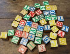 colorful wooden blocks spelling alphabets on a table