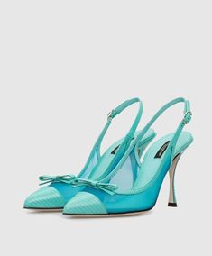 These Dolce & Gabbana mesh slingback pumps reek of elegance. Don't let their classic shape fool you, as the blue leather, mesh panelling, and slim bows add a glamorous, feminine touch. Perfect for strutting your stuff with a pointed toe, contrasting toe cap, slingback ankle strap, and sky-high stiletto heel. Finished with a leather sole. Model: Slingback heels Color: Light Blue Material: 60% PA+40% Calf Leather Buckle closure Leather bottom sole Made in Italy Elegant Mesh Heels With Heel Strap, Evening Mesh Slingback Heels, Party Heels With Heel Strap And Mesh Material, Mesh Heels With Heel Strap For Party, Luxury Mesh Heels, Evening Mesh Heels With Heel Strap, Luxury Party Heels In Mesh, Luxury Mesh Heels For Party, Luxury Party Mesh Heels