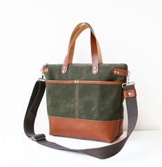 Green Waxed Canvas Tote Bag/Crossbody Bag   *Vegetable Tanned Genuine Leather  Approximate  Dimensions: 15.5" Top Wide, 11"Wide (at base) x 10.5"High x 4"Deep 40cm Wide Top, 28cm Wide (at base) x 27cm Hide x 9 cm Deep This beautiful tote bag/crossbody bag has been made with green waxed canvas fabric and brown genuine leather. The bag is lined with brown waterproof canvas fabric. There are 2 slip pockets in the front and a zipper pocket at the back side of the bag. There are zipper and 2 slip pockets in the bag. * For more colours, you can contact with no hesitate. Fabric and Washing guidelines: Waxed canvas  is a durable fabric that is made out of 100% sturdy cotton canvas and processed with waxed for water resistance. It is medium weight.  You can clean it with a damp cloth. I would not r Green Canvas Bag, Waxed Canvas Tote Bag, Green Crossbody Bag, Grey Tote Bags, Grey Crossbody Bag, Waxed Canvas Bag, Green Tote Bag, Green Tote, Vintage Leather Bag