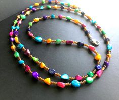 Cheap Colorful Beads Long Necklace, Luxury Multicolor Beaded Fusion Necklaces, Luxury Long Multicolor Beaded Necklace, Long Beaded Necklace With Gemstone Beads For Beach, Long Gemstone Beaded Necklaces For Beach, Long Gemstone Beaded Necklace For Beach, Spiritual Beaded Necklaces With Oval Beads For Beach, Beach Long Necklace With Large Multicolor Beads, Beach Long Multicolor Necklace With Large Beads