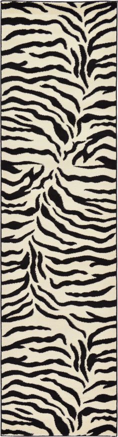 an animal print rug with black and white stripes