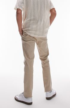 A skinny fit lends contemporary appeal to classically styled twill chinos made with a hint of easy-moving stretch. 31 1/2" inseam; 13" leg opening; 10 1/2" front rise; 14" back rise (size 32) Zip fly with button closure Side-seam pockets; back button-welt pockets 99% cotton, 1% spandex Machine wash, line dry Imported Slim Fit Pants For Business Casual, Fitted Tapered Leg Spring Chinos, Fitted Spring Chinos With Tapered Leg, Spring Fitted Tapered Leg Chinos, Casual Slim Fit Chinos In Chino Cotton Twill, Slim Fit Chinos With Straight Hem For Spring, Slim Fit Spring Pants With Standard Cut Leg, Fitted Chino Cotton Twill Chinos For Spring, Classic Mid-rise Work Pants