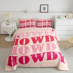 a bedroom with pink bedding and white walls