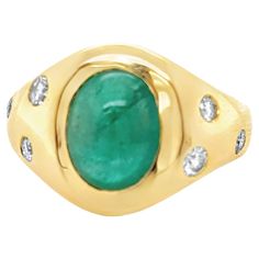 Beautiful Oval Cabochon Emerald & Diamond Cocktail Ring features a 3.42 carats Natural Beryl Oval Vivid Green Zambian Cabochon Emerald with 7 Round Brilliant shape Diamonds set in 18k Yellow Gold. Total diamond weight is 0.39 carats. Ring size is 6 . Ring weighs 10.33 grams. 18k Yellow Gold. Ring Size: 6 Metal: 18K gold Primary Stone: Emerald Stone Cut: Cabochon Weight: 3.42 carats Lab Report :GFCO Origin : Zambia Side Stones : Natural Diamonds Weight : 0.39 carats Cutting: Round Brilliant Color Lab Report, Diamond Cocktail Ring, Emerald Diamond Ring, Diamond Cocktail Rings, Emerald Stone, Yellow Gold Ring, Stone Cuts, Emerald Diamond, Oval Cabochon