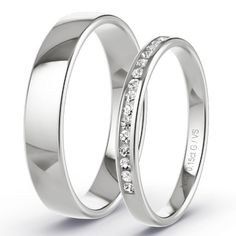 two white gold wedding rings with channeled diamonds on each side, set in 18k white gold