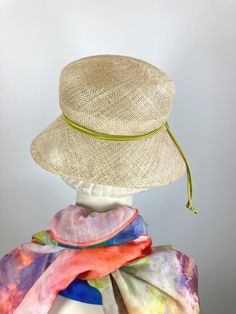 Meet "Pearl," a women's lightweight natural Open Weave Straw Summer Medium Brim Hat that is just the ticket for Ladies Tea, Church, or for everyday wear. The straw is an airy open weave in a natural straw and has tiny knots as part of the design. The brim is shorter in the back and wider at the front and sides. It is completely hand blocked over vintage wooden hat blocks and then hand sewn. It has a low and shallow domed crown (top). It is simply adorned with a narrow apple green band. An inner Handwoven Curved Brim Straw Hat For Kentucky Derby, Fitted Woven Straw Hat For Spring, Spring Fitted Woven Straw Hat, Beach Mini Hats With Flat Brim, Woven Short Brim Boater Hat, Handwoven Curved Brim Hat For Kentucky Derby, Spring Straw Hat With Short Brim In Toquilla, Spring Toquilla Straw Hat With Short Brim, Chic Beige Straw Cloche Hat