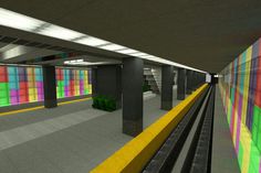 an empty subway station with multicolored walls