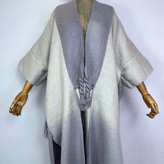 This super soft and warm wool cardigan kimono is perfect for the cold weather. Unlike other sweaters and wools, the wool used for this beauty is non itchy. Think of your favorite throw blanket, the comfort and warmth it gives but 10x stylish and wearable any where. This kimono is all that and more! One size fits S-4X Material: Wool One Size Fits Most Size Chart Cashmere Shawl Collar Outerwear For Winter, Cashmere Outerwear With Shawl Collar For Winter, Winter Loungewear Sweater Coat With Soft Texture, Winter Layering Sweater Coat With Soft Texture, Oversized Cashmere Outerwear For Winter, Cozy Gray Winter Sweater Coat, Gray Long Soft Knit Outerwear, Soft Wool Sweater For Winter, Winter Wool Sweater With Soft Texture