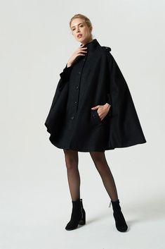 black wool cape #xiaolizi #winter #capecoat Winter Poncho With Cape Sleeves, Chic Black Wool Cape, Chic Black Capelet, Elegant Black Long Cape, Elegant Long Black Cape, Oversized Cape With Cape Sleeves, Elegant Solid Color Winter Cape, Elegant Solid Winter Cape, Elegant Winter Cape