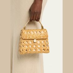 Cult Gaia "Sybil" crossbody bag in cutout rattan and leather  Flat top handle  Detachable crossbody strap Can be worn as a top handle or crossbody bag  Flap top with magnetic closure  Approx. 3.5"H x 7.9"W x 0.1"D Spot clean Imported Cult Gaia, Flats Top, Leather Flats, Crossbody Strap, Magnetic Closure, Top Handle, Crossbody Bag, Tops Designs, Gift Ideas