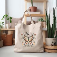 This farmers market-style canvas tote is a great for every day use or as a gift for someone special. You can use it for a trip to the market or for your day at the spa or Yoga studio.  We use a high quality professional direct to garment (DTG) process on our products, this means fabric-grade ink is printed directly onto the garment blending with the fibers. This process allows us to achieve a vintage style look on many of our designs, and a feel that is similar to screen-printing (which avoids t Bohemian Canvas Bag With Large Capacity For Everyday, Bohemian Canvas Bag For Everyday Spring Use, Bohemian Large Capacity Canvas Bag For Everyday Use, Spring Bohemian Canvas Tote Bag, Everyday Bohemian Tote Canvas Bag, Bohemian Canvas Shoulder Bag, Bohemian Cotton Canvas Bag For Daily Use, Bohemian Everyday Canvas Gift Bag, Bohemian Cotton Bag For Everyday