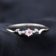 Product Details Add a touch of elegance to your life with this exquisite Leaf Promise Ring. It features a mesmerizing Round Shape Rose Quartz gemstone, delicately set in a 6-Prong Setting. Inspired by the natural beauty of a Leaf Branch, this ring showcases a stunning design that is both graceful and unique. The presence of scintillating round Diamond gems, intricately studded in a leaf design, enhances the beauty of this ring even further. Product Information SKU SHP-RINGS0821200137 Width 2.8 mm Height 3.7 mm Weight 1.26 gm (Approximate) ROSE QUARTZ INFORMATION No.of Stones 1 Pieces Total Weight 0.28 Carat (Approximate) Dimension(approx) Round-4X4 mm-1 Pcs Color Pink Cut Brilliant Shape Round Setting Type Prong-Setting Quality Grade AAA DIAMOND INFORMATION No.of Stones 6 Pieces Total Weig Dainty Flower Ring, Promise Ring Unique, Pretty Promise Rings Silver, Rose Quartz Promise Ring, Promise Rings Simple Silver, Crystal Promise Rings, Pretty Promise Rings, Unique Promise Rings For Her, Simple Promise Rings For Her