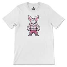 Hopping into a powerful workout has never been this fierce! Introducing our "Gym Bunny" T-Shirt, designed for those who match their strength and agility with a playful charm. Don this t-shirt and let your fitness journey be as vibrant and energetic as a lively bunny. Made from soft, breathable fabric, this t-shirt ensures your comfort while you're pumping iron or crushing that cardio. So, are you ready to transform into a gym bunny and start flexing those muscles with style? Casual Gym T-shirt With Screen Print, Casual Gym T-shirt With Graphic Print, White Athletic Fit T-shirt For Workout, Athleisure Graphic Print T-shirt For Training, Sporty Short Sleeve T-shirt For Gym, Pre-shrunk Crew Neck Workout T-shirt, Pre-shrunk Crew Neck T-shirt For Workout, Graphic Tee Short Sleeve Gym T-shirt, Gym T-shirt With Screen Print Short Sleeve