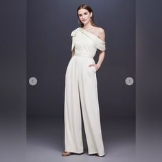 Excellent Condition! Never Worn. No Flaws. Just Needs A Good Steam. Perfect For Rehearsal Dinner, Bachelorette Or Wedding Reception Or After Party. Get It Before It’s Gone! White Off-shoulder Evening Jumpsuits And Rompers, White Off-shoulder Jumpsuits And Rompers For Evening, Chic White Jumpsuit For Wedding Guests, Chic White Jumpsuits And Rompers For Wedding Guest, White One-shoulder Jumpsuit For Evening, Chic White Jumpsuit For Event, Chic Bridesmaid Jumpsuits And Rompers, Elegant Summer Bridesmaid Jumpsuits And Rompers, Elegant White Jumpsuit For Formal Occasions