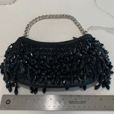 Used Once . Looks Brand New. Chic Beaded Shoulder Bag For Party, Elegant Party Bag With Black Beads, Elegant Party Bags With Black Beads, Black Evening Bags With Sequins, Embellished Black Bags For Night Out, Black Embellished Bags For Night Out, Chic Black Evening Bag With Rhinestones, Black Sequined Bags For Formal Occasions, Black Rhinestone Shoulder Bag For Events