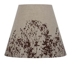 a lamp shade with brown and white flowers printed on the fabric, it is also available as a lampshade