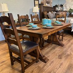 a wooden table with blue dishes on it