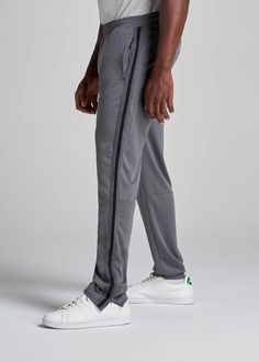 About Our Tall Men's Pants These men's tall athletic pants are a classic take on an athleisure essential. When it comes to athleisure, a good fit is key. You need something that's comfortable enough to relax in yet capable enough to work out in – but as a tall guy, it can be hard to find options that work for your height. You either have to compromise on a baggy fit or settle for lengths that are way too short. Not anymore. We know how hard it is to find quality styles when you're tall, which is Athleisure Jogging Bottoms With Side Stripes, Athleisure Bottoms With Side Stripes For Jogging, Sports Pants With Side Stripes And Stretch Fit, Sporty Stretch Joggers With Side Stripes, Stretch Sports Pants With Side Stripes, Sporty Relaxed Fit Activewear With Side Stripes, Functional Moisture-wicking Full-length Sweatpants, Moisture-wicking Full Length Sweatpants, Functional Moisture-wicking Full Length Sweatpants