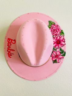 Standard brim festival style hat.  Barbie themed!  Design was burned in and painted.  One size fits all with adjustable ribbon in the brim. Pink Adjustable Fedora Felt Hat, Pink Wide Brim Costume Hat For Festival, Adjustable Pink Fedora Felt Hat, Pink Adjustable Fedora With Curved Brim, Pink Adjustable Curved Brim Fedora, Adjustable Pink Fedora With Curved Brim, Whimsical Short Brim Adjustable Felt Hat, Pink Adjustable Felt Hat With Flat Brim, Whimsical Mini Hat With Adjustable Flat Brim