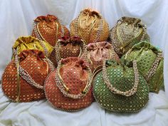 Lot Of 100 Indian Handmade Women's Embroidered Clutch Purse Potli Bag Pouch Drawstring Bag Wedding Favor Return Gift For Guests Free Ship PRODUCT DETAIL :- -------------------------- Product Item : Embroidered Potli Bags Size : 9x9 INCHES Product Line: Rajasthani Ethnic Women Handbag Potli Bags Material -: Fabrics, Beads Occasion: Any Occasion, Festive, Party, Wedding, Bridal PRODUCT DESCRIPTION :- This colorful Clutch Purse with vibrant colors & ethnically designed is a specialty from Rajasthan Embroidered Clutch Purse, Wedding Party Bags, Pouch Drawstring, Gift For Guests, Indian Wedding Favors, Potli Bag, Embroidered Clutch, Return Gift, Potli Bags