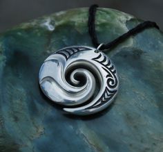 Sterling Silver Koru Wave Pendant connections with by JackieTump Symbolic Carved White Gold Jewelry, Artisan Carved Sterling Silver Jewelry, Adjustable Carved Sterling Silver Jewelry, Spiral-shaped Engraved Sterling Silver Jewelry, Engraved Sterling Silver Spiral Jewelry, Symbolic Spiral Sterling Silver Jewelry, Symbolic Adjustable Spiral Jewelry, Adjustable Symbolic Spiral Jewelry, Elegant Sterling Silver Jewelry With Adjustable Cord